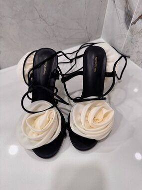 Elegant Black Strappy Sandals with Cream Floral Accent